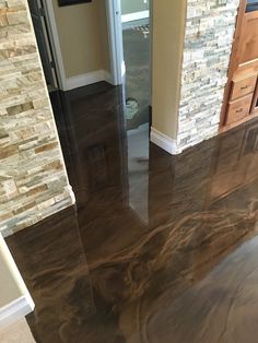 the floor is shiny and ready to be used in this home's new kitchen