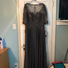 Perfect Dress For Mother Of The Bride. Dress Never Worn, Tags Still On It. Lace Top With Sheer Neckline And Sleeves With A-Line Chiffon Skirt Collection: Mother Of The Bride Season: Spring 2019 Color: Charcoal Fabric: Chiffon Style: A-Line Length: Long, Maxi Dress For Mother, Charcoal Dress, Dresses Mother Of The Bride, Skirt Collection, Chiffon Style, Chiffon Fashion, Mother Of The Bride Dress, Chiffon Skirt, Long Maxi