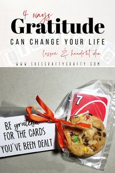 a cookie wrapped in plastic and tied with an orange ribbon