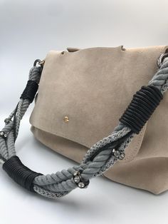 Paracord and Leather Designer Bag Strap (Only bag strap, BAG NOT INCLUDED) Update your favourite bag with this designer strap. This  bag strap is interchangeable with it's lobster claw fastening. MATERIAL: Paracord , real leather and po leather WIDTH: 2,5cm  LENGTH:  Length 70 cm including snap hooks.  COLOR:  Gray paracord, beige leather, cream po leather Very good quality, stylish designer bag strap Can be used to give a trendy and stylish look to your old bags. Good idea as a birthday or new year gift. Beige Bags With Braided Handles, Beige Bag With Braided Handles For Fashion, Braided Handles Crossbody Shoulder Bag, Chic Bag Strap With Leather Handles For Daily Use, Elegant Bag Strap With Leather Handles For Daily Use, Luxury Beige Bag Strap For Everyday Use, Elegant Beige Bag Strap For Everyday Use, Leather Handle Tote Shoulder Bag As Fashion Accessory, Beige Shoulder Bag With Detachable Strap