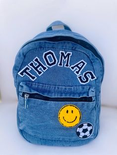 ✨Personalize with your choice of patches✨ Can fit up to 5 patches straight across or up to 6 curved. Letter patches count towards total patch count.  Bag is a heavy duty denim material and measures approx 12" tall and 9.4" wide and 4.7" deep. Straps are adjustable and reinforced. Please reach out if you would like more boy patch options- I can special order some. The patches shown in the first photo are available in black, blue, or white. Customizable Cute Backpack For School Events, Casual Handmade School Backpack, Casual School Backpack With Logo Patch, Daily Use Backpack With Logo Patch, School Bag With Letter Patch For Back To School, School Bags With Letter Patch For Back To School, School Backpack With Logo Patch, Back To School Bags With Letter Patch, Embroidered Patch Backpack For Everyday Use