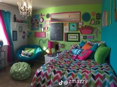 a bedroom decorated in bright colors with colorful bedding and decor on the walls, along with a chandelier