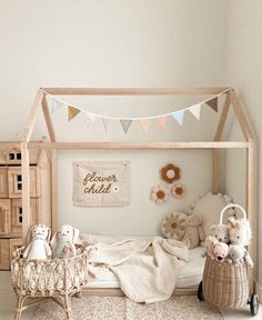 a child's room with a bed, toys and decorations on the floor in front of it