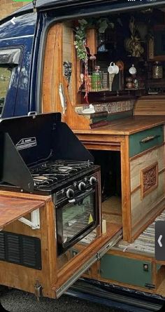 an old camper van has been converted into a bar and grill area for entertaining