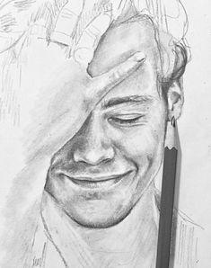 a pencil drawing of a smiling man with his eyes closed