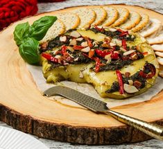 a platter with crackers and vegetables on it