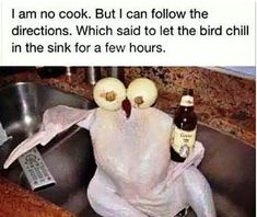 a turkey sitting in a kitchen sink holding two beer bottles