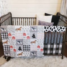 a baby crib with a blanket on top of it and some pillows in the background