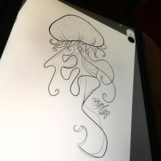 a drawing of a jellyfish on a sheet of paper