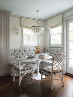 the instagram page shows an image of a dining room with white furniture and chandelier