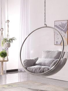 a hanging chair in the middle of a room