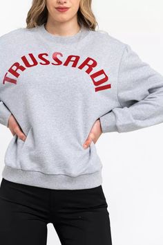 Elevate your loungewear with the upscale comfort of Trussardi’s oversized round-neck sweatshirt. Crafted in a sumptuous blend of cotton and polyester, this Italian-made piece adds a touch of luxury to laid-back days with its soft texture and stylish dropped-shoulder design. A statement in minimalism, the gray silhouette is emblazoned with maxi lettering across the chest for an understated yet bold declaration of brand love. Perfect for those who adore fashion with a casual, chic edge. Material: Sweat Gris, Jeans And Flats, Fashion Forever, Round Neck Sweatshirts, Sweatshirts Online, Grey Prints, Oversized Pullover, Round Neck Sweaters, Sweaters Online