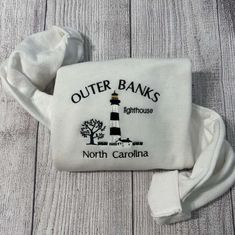 Introducing our Outer Banks of North Carolina Embroidered Sweatshirt 2D Crewneck Sweatshirt For Family, a cozy and stylish addition to your wardrobe that celebrates the beauty and charm of the Outer Banks. Whether you’re a resident or a visitor, this sweatshirt is a must-have for anyone who wants to showcase their love for this breathtaking coastal destination. Our sweatshirt is crafted with meticulous attention to detail, ensuring the highest quality and durability. It features intricate The Outer Banks, Crewneck Design, Oversized Crewneck, Mackinac Island, Custom Sweatshirts, Embroidered Sweatshirt, Cozy Sweatshirts, Embroidered Sweatshirts, Text Design