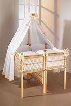 a baby crib in front of a window