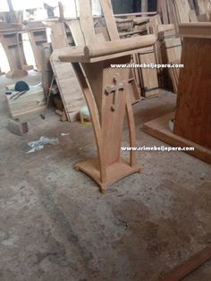 wooden chairs are being made in a workshop