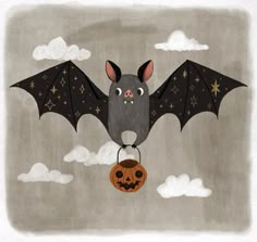 a bat flying in the sky with a pumpkin