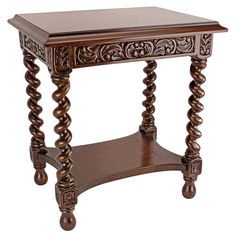 an ornate wooden table with carved wood legs