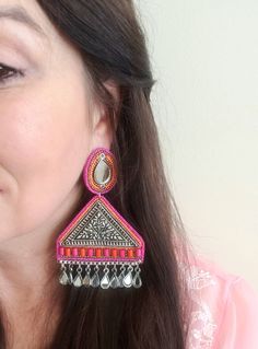 Turn heads wearing this unique and colorful large German silver triangular Afghani earrings with mirror stud and mirror dangles. Colorful seed beads. Fabric backed for comfort Weight 29 gm. find even more great earrings here: https://www.etsy.com/shop/boutiquebymaryam?section_id=22797814 Shop BoutiqueByMaryam: https://www.etsy.com/shop/boutiquebymaryam All my jewelry is boxed and wrapped to be ready for gift giving. I'm happy to ship directly to your recipient. Thank you for your support! Bohemian Silver Earrings With Mirror Work, Silver Beaded Earrings For Festival, Bohemian Earrings With Mirror Work For Party, Handmade Silver Beaded Earrings For Festival, Afghani Earrings, Afghani Jewelry, Mirror Earrings, Pomegranate Earrings, Mirror Jewelry