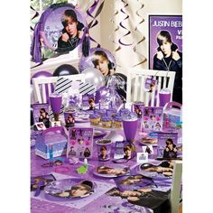 a table with purple decorations and pictures on it