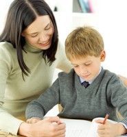 a woman helping a boy do homework at a desk with the words, math - where can you get homework help?