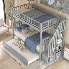 there is a bunk bed with two sets of stairs on the bottom and second floor