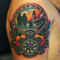 a man with a compass tattoo on his arm