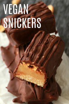 vegan snickkers with chocolate and peanut butter on top, one cut in half