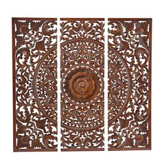 three pieces of carved wood with an intricate design