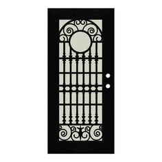 a black and white door with wrought iron designs on the front panel, side panels and sides