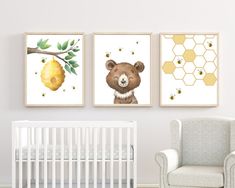 a baby's nursery room with three prints on the wall