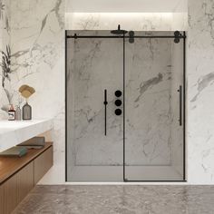 a bathroom with marble walls and flooring next to a white counter top, two sinks and a shower stall