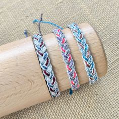 This listing is for one metallic cord braided bracelet.  Choose from one of 3 color ways- 1.  Navy/maroon/white with silver metallic cord 2.  Gray/pink/purple with silver metallic cord 3.  Teal/copper/blue with silver metallic cord Have an idea for a custom listing?  Send me a convo, I reply quickly.   Perfect for stocking stuffers!   Each bracelet will fit all wrist sizes and is 100% waterproof.   All bracelets are made and ready to ship within 48 hours.  Thanks for looking! Adjustable Braided Waxed Cord Bracelets, Adjustable Waxed Cord Braided Bracelet, Festival Braided Bracelets With Sliding Knot, Silver Braided Bracelet With Sliding Knot, Festival Braided Bracelet With Adjustable Waxed Cord, Friendship Braided Bracelet With Adjustable Nylon Cord, Friendship Braided Bracelet In Nylon Cord, Friendship Adjustable Braided Waxed Cord Bracelets, Friendship Braided Bracelets With Adjustable Waxed Cord