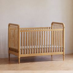 a baby crib sitting in the corner of a room