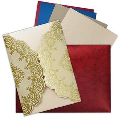 three different colored envelopes with lace on them