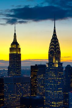 the empire building is lit up at night