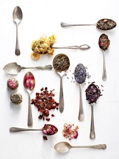 various spoons with different types of flowers and herbs