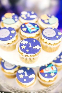 cupcakes with blue frosting and space themed decorations