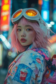 a girl with pink hair and goggles on her head is standing in the street