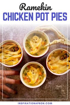 three bowls filled with chicken pot pies on top of a table next to a person's hand