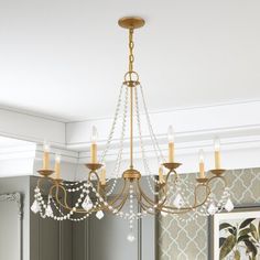 a chandelier hanging from the ceiling in a room