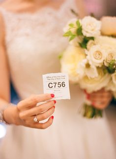 the bride is holding her wedding bouquet and price tag for $ 75, which she also has on her wrist