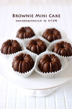 brownie mini cake sitting on top of a white plate