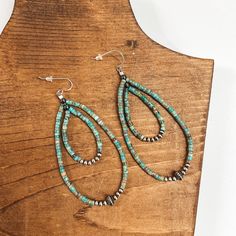 These gorgeous earrings are genuine Native American artwork. They include a long turquoise beaded teardrop with sterling silver Navajo pearls.Earrings measure approximately 3.5 inches long. SKU: #1103-2229 Turquoise Nickel-free Southwestern Teardrop Earrings, Bohemian Beaded Turquoise Teardrop Earrings, Bohemian Turquoise Beaded Teardrop Earrings, Handmade Southwestern Turquoise Teardrop Earrings, Handmade Turquoise Teardrop Earrings Southwestern Style, Handmade Turquoise Teardrop Earrings In Southwestern Style, Southwestern Teardrop Beaded Earrings, Turquoise Teardrop Beaded Bohemian Earrings, Turquoise Bohemian Beaded Teardrop Earrings