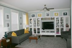 a living room filled with furniture and a flat screen tv