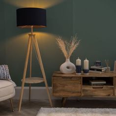 a living room scene with focus on the floor lamp and side table in front of it