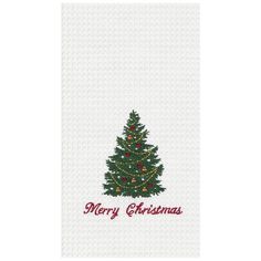 a christmas tree on a white towel with merry lettering in red and green letters,