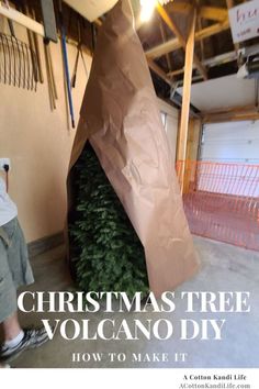 a man standing in front of a christmas tree that is wrapped in brown paper with the words, christmas tree volcano diy how to make it