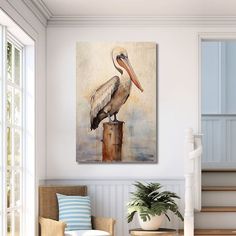 a painting of a pelican sitting on top of a post in a living room