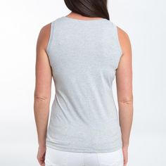 The Myla V-Neck Tank features a on trend light gray color with cute notch v-neck. Lightweight and easy to pair with anything in your closet, this top is an absolute summer essential. Our classic v-neck accent tank top is made from lightweight and breathable fabric with smooth soft feeling, providing this cami tank top for women a skin-friendly feel with noticeable softness. This neutral tank top for women can be worn in a multitude of ways from layering or as a summer top with multiple color opt Light Gray Color, Tank Top For Women, Soft Feeling, Summer Essential, Top For Women, Tank Top Cami, Multiple Color, Cami Tanks, White Tank Top