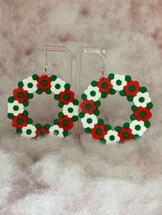 Christmas wreath earrings made from perler beads. Christmas Perler Bead Earrings, Perler Bead Wreath, Perler Christmas, Perler Bead Earrings, Christmas Wreath Earrings, Melt Beads, Bead Wreath, Christmas Perler Beads, Wreath Earrings